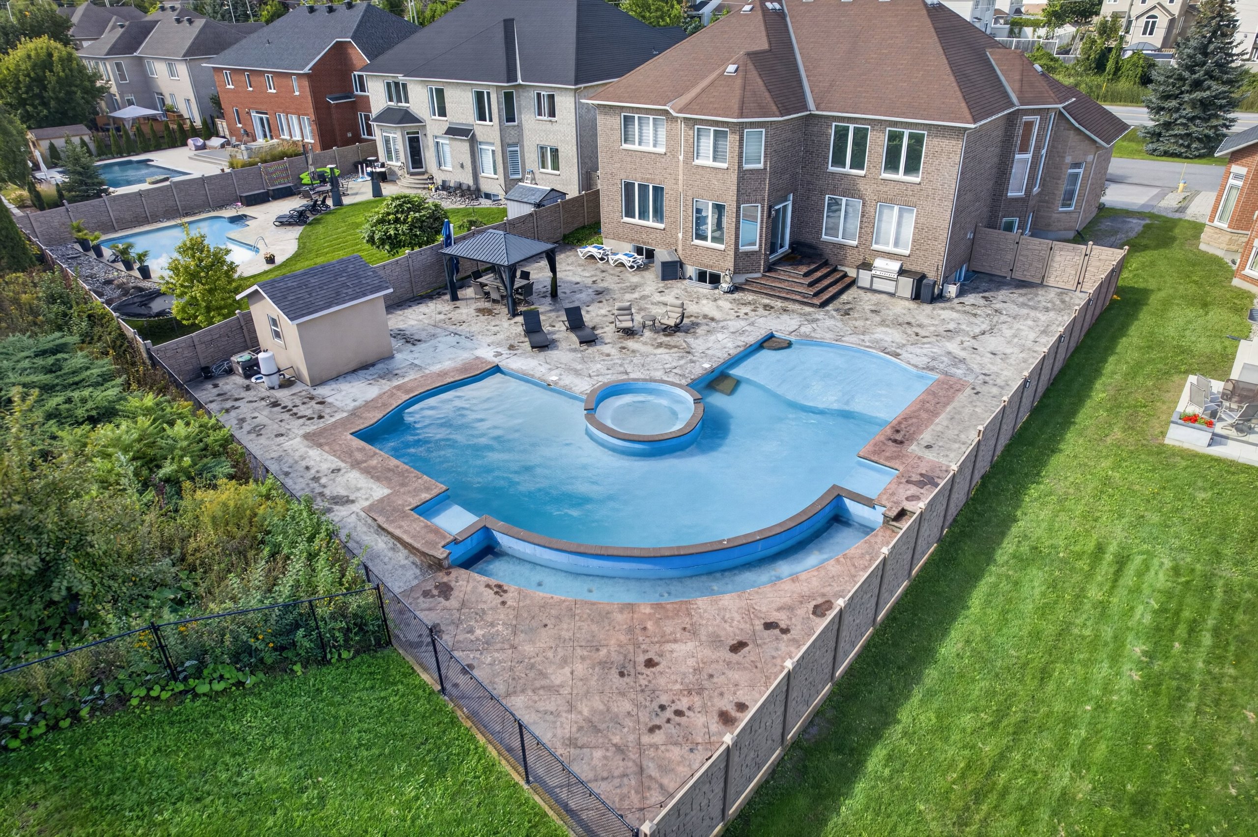 Aerial view of the pool and rear yard
