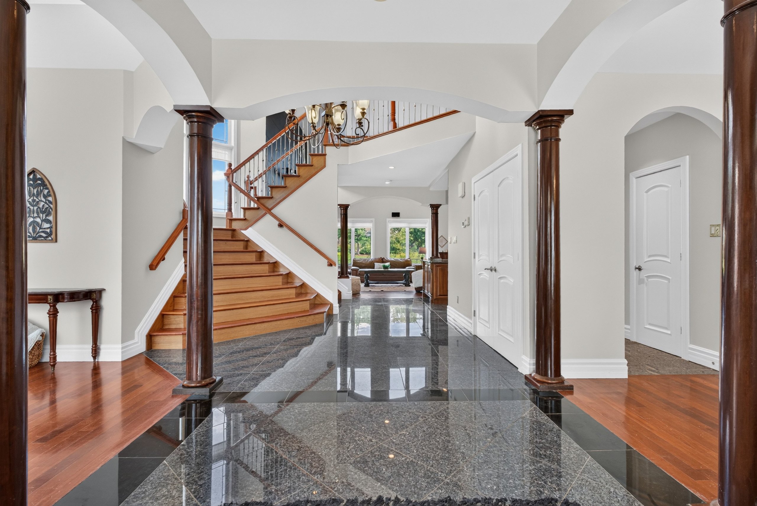 Granite foyer with solid wood columns