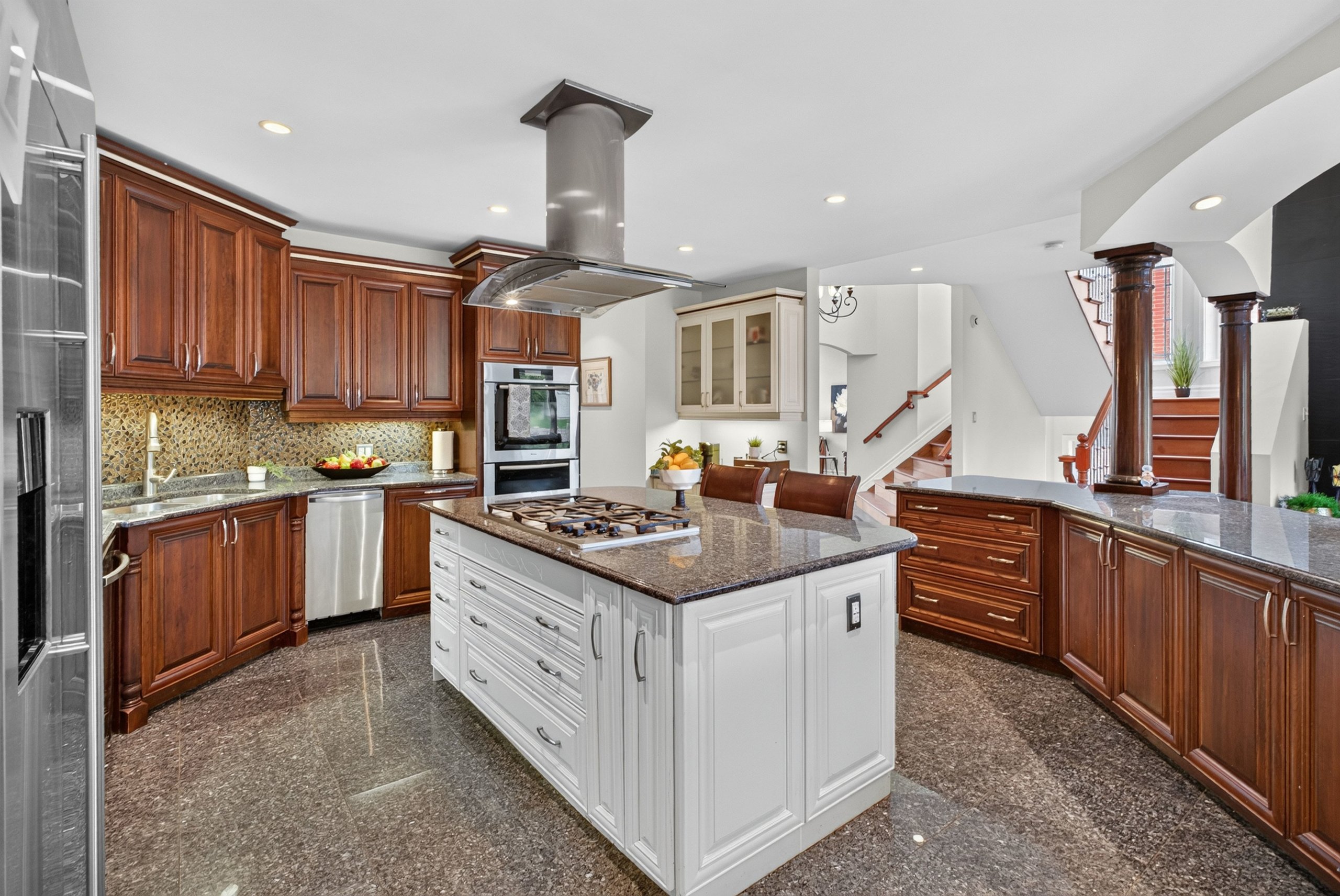 Kitchen with cherry cabinetry and granite counters